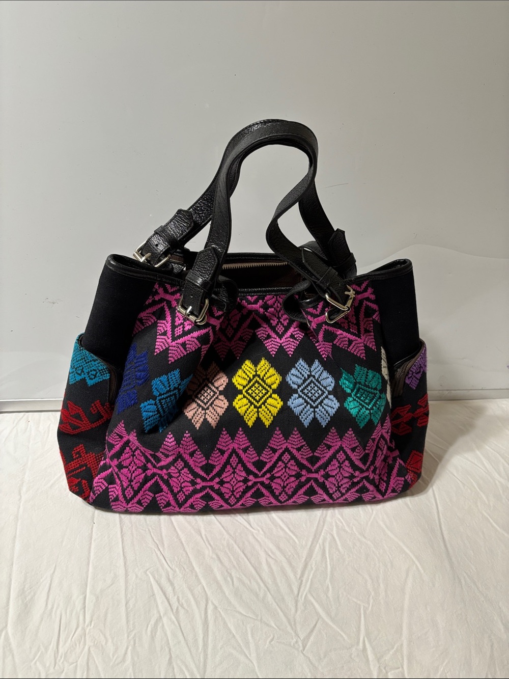 Black Woven Tote Bag with Multicolor Floral Embroidery fabric with leather trim.
